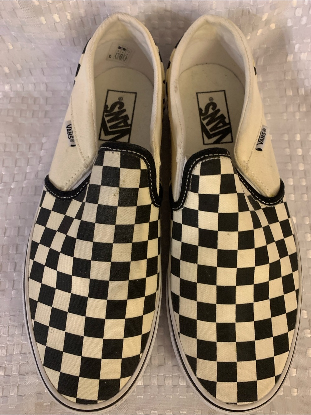 Vans women’s Slip-On black and off-white classic Checkerboard Sneakers - size 9.
